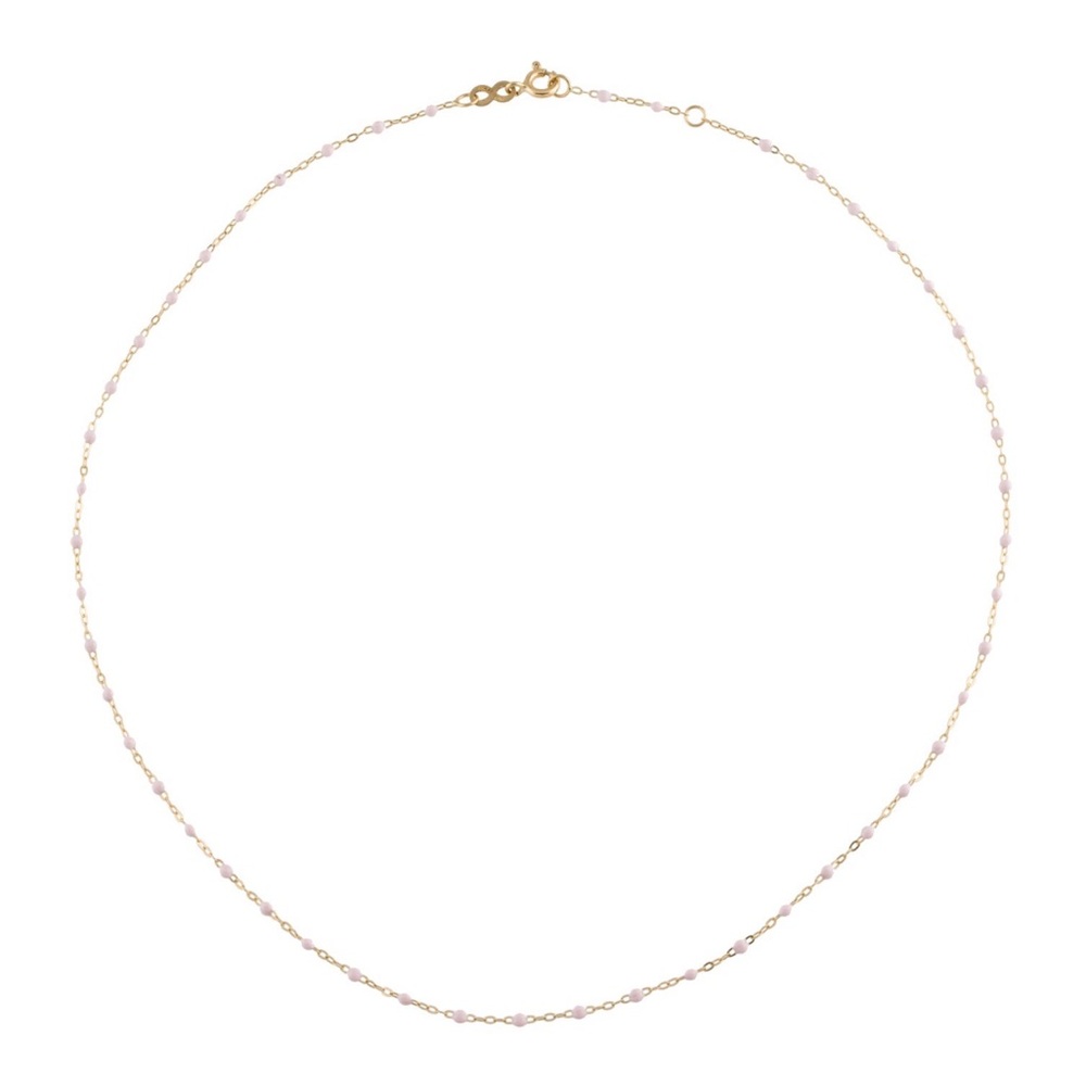 Gigi Clozeau pink resin and gold 16.5 inch necklace with original pouch.